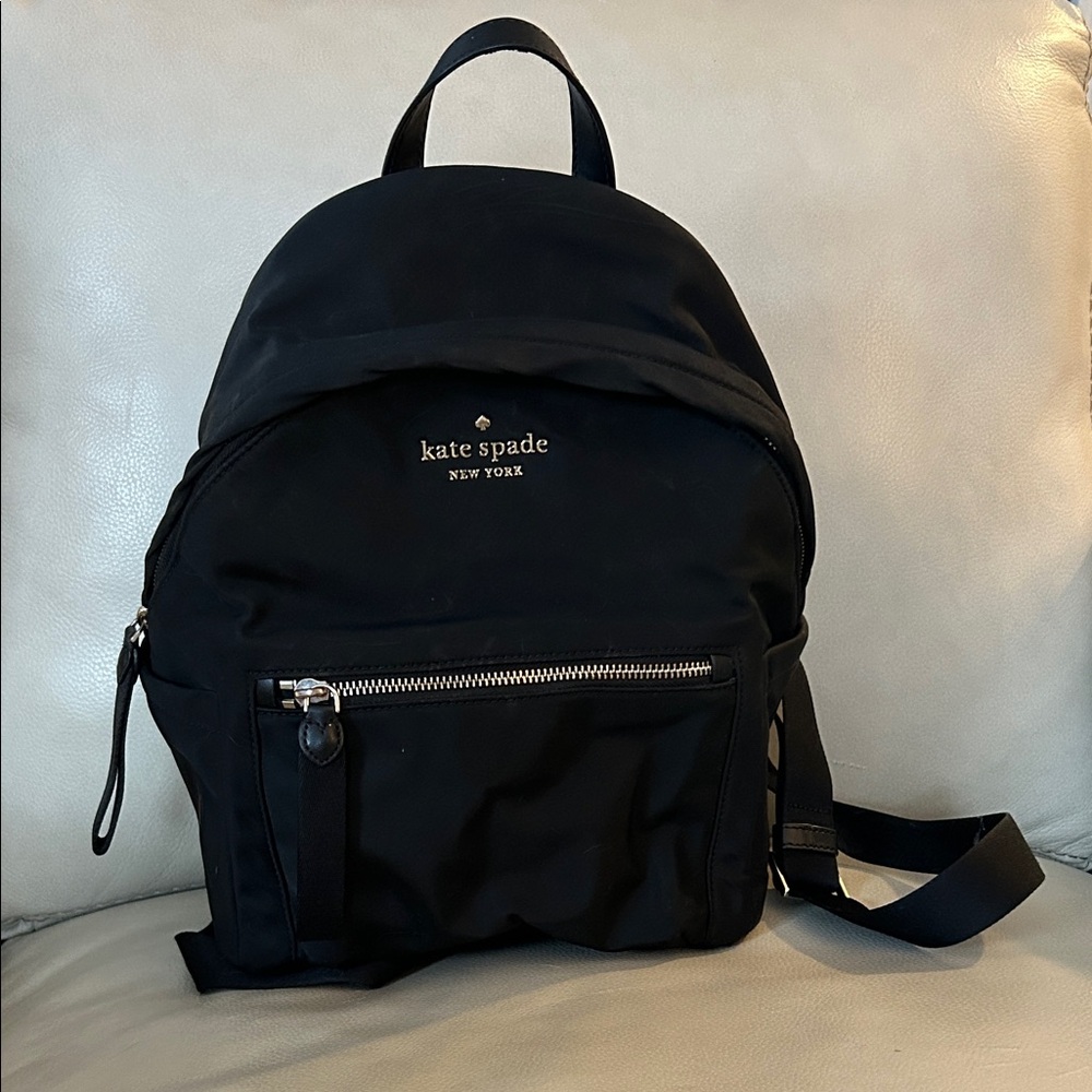 Kate Spade Black Backpack Purse “Chelsea”
Model